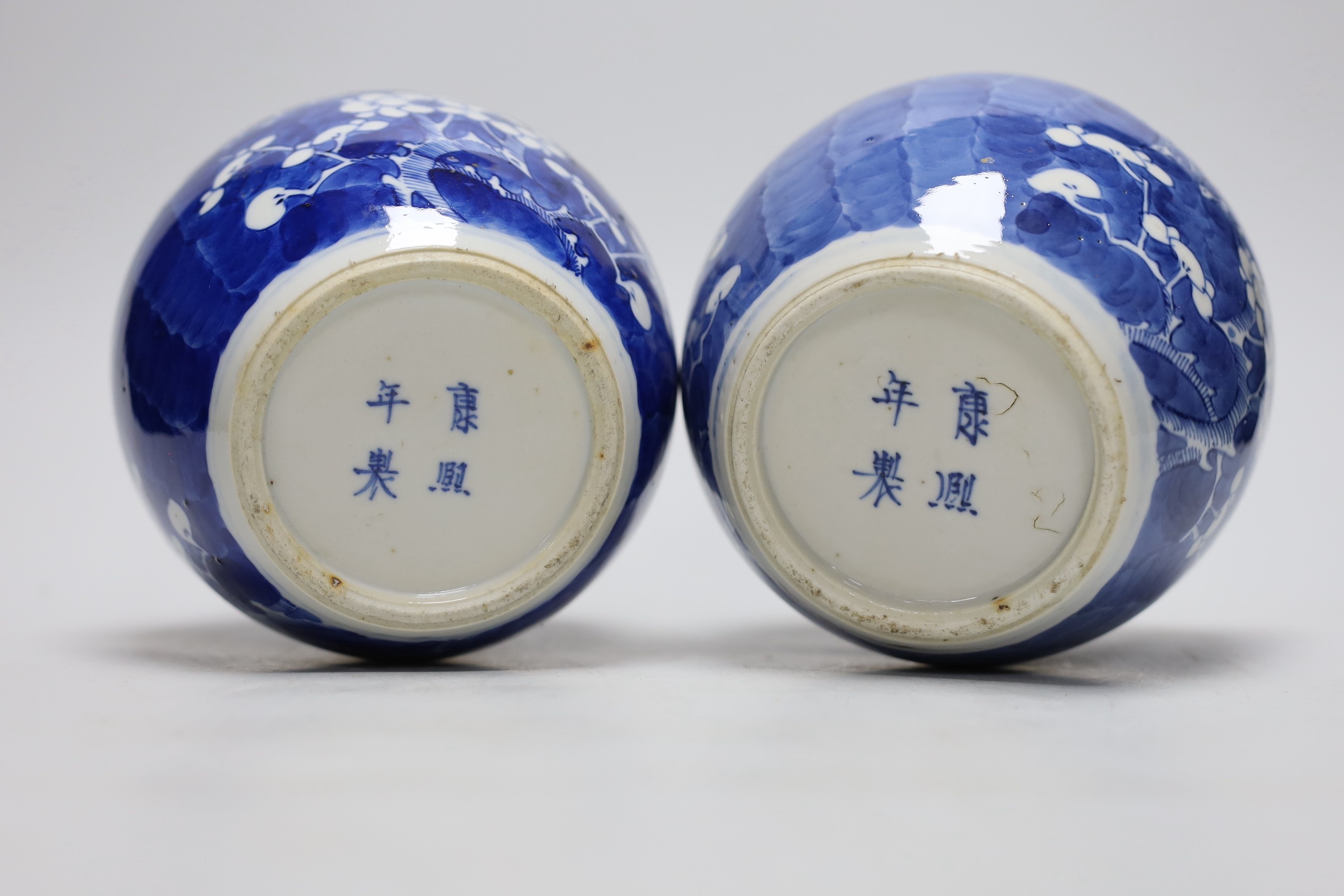 A pair of 19th centiury Chinese blue and white prunus jars, 13.5cms high